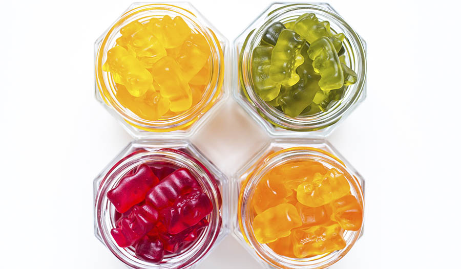 Gummy vitamins in clear glass jars