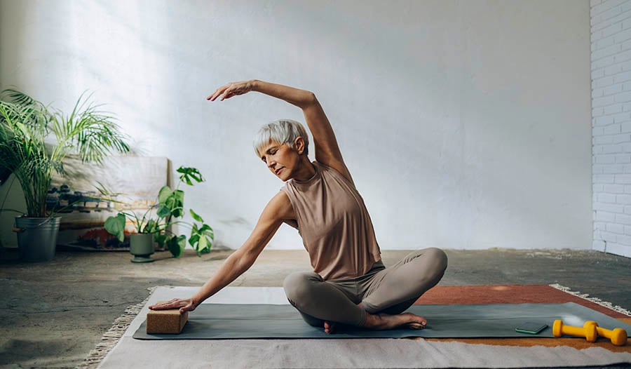 Woman doing yoga on mat