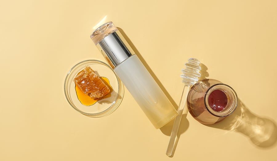 Bee skincare product with honeycomb and honey