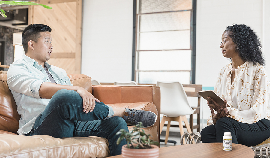 Male talking to therapist in office