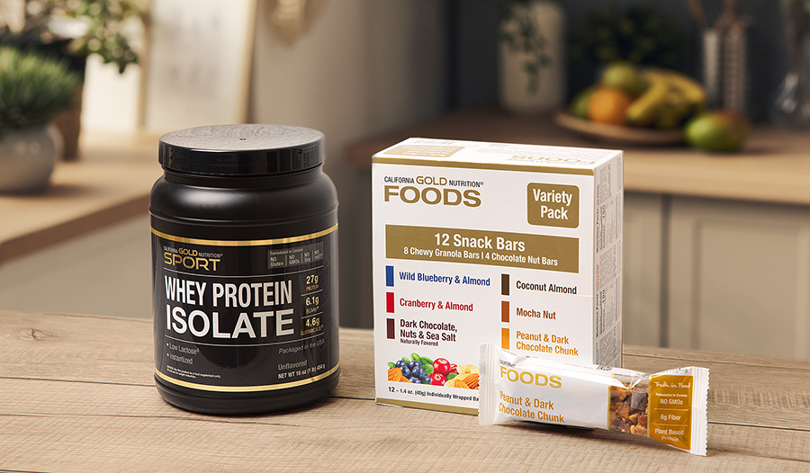 Healthy snacks like whey protein and power bars on kitchen counter 