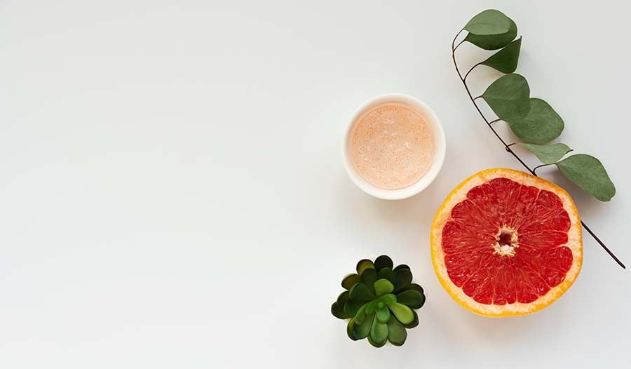 Grapefruit seed extract concept on white background