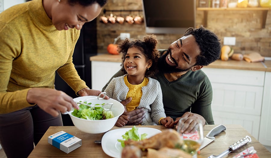 Young family eating healthy holiday meal