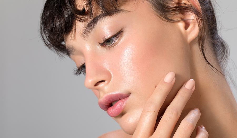 woman with glass skin showing off complexion