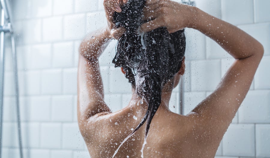 woman in shower washing hair