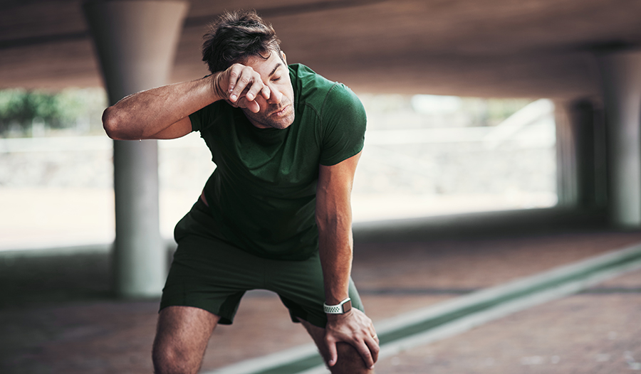 Male athlete taking a break from a tough workout 