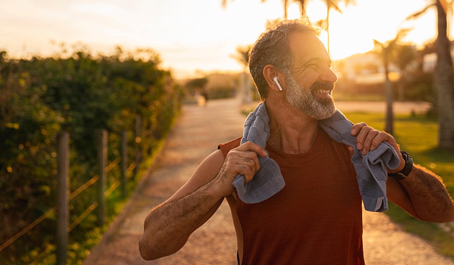 Healthy man taking a break outside after a run