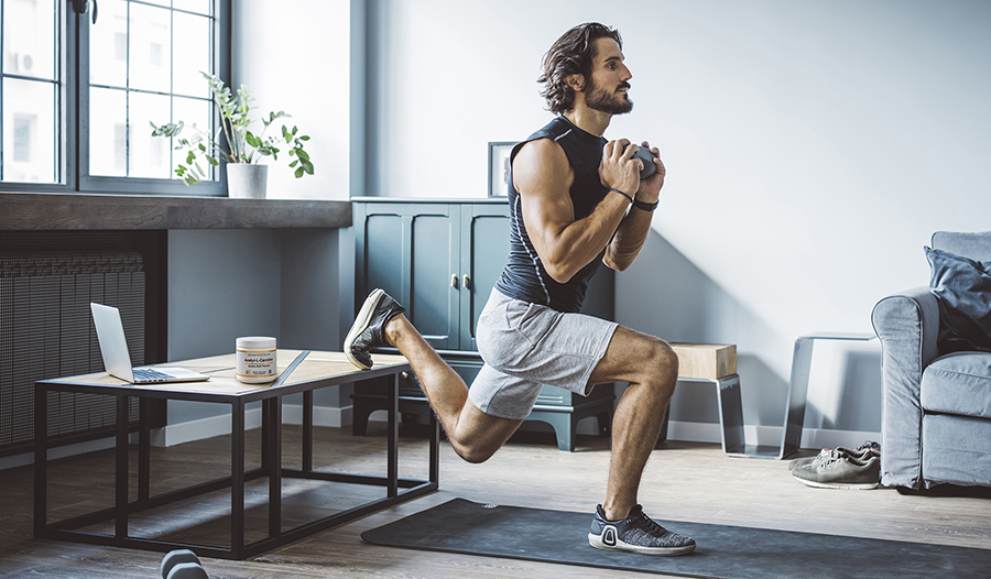 Athletic male working out from home