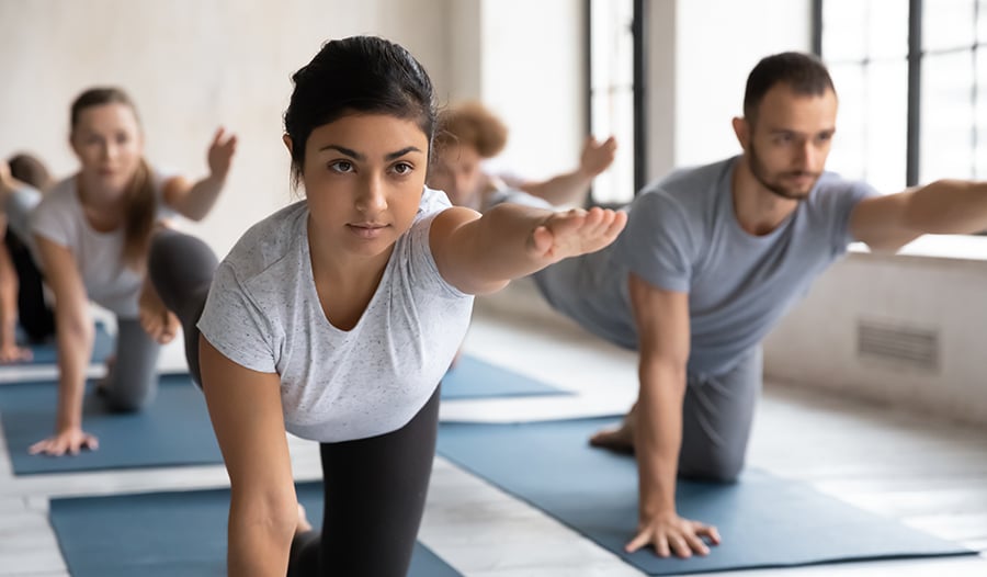 Healthy yogis doing yoga