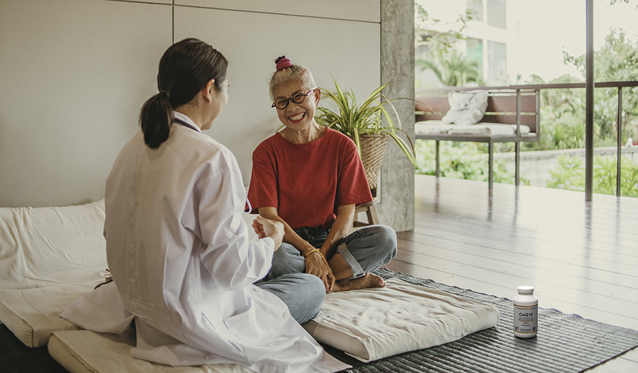 Doctor talking to elderly patient in serene location