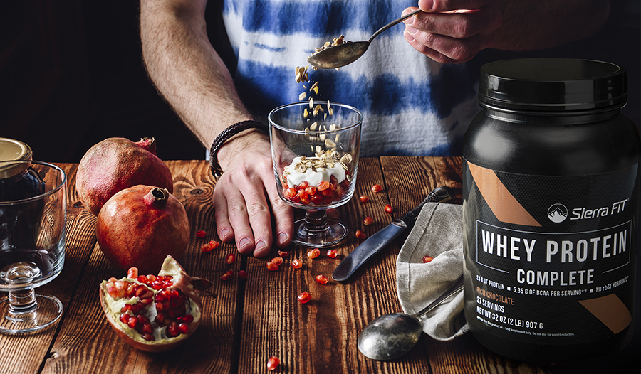 Male making yogurt with fruit and protein 