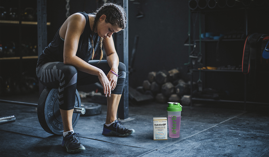 Fit female taking a break from working out in the gym