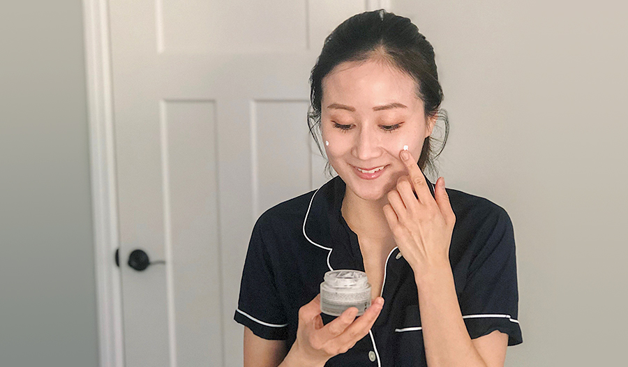 dr jenny liu applying retinol skincare to her face