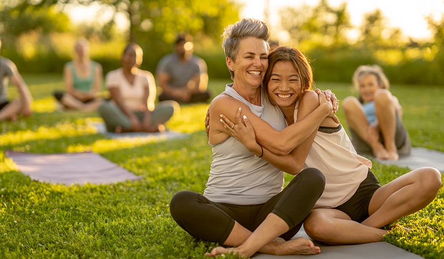 Healthy women doing yoga in the park